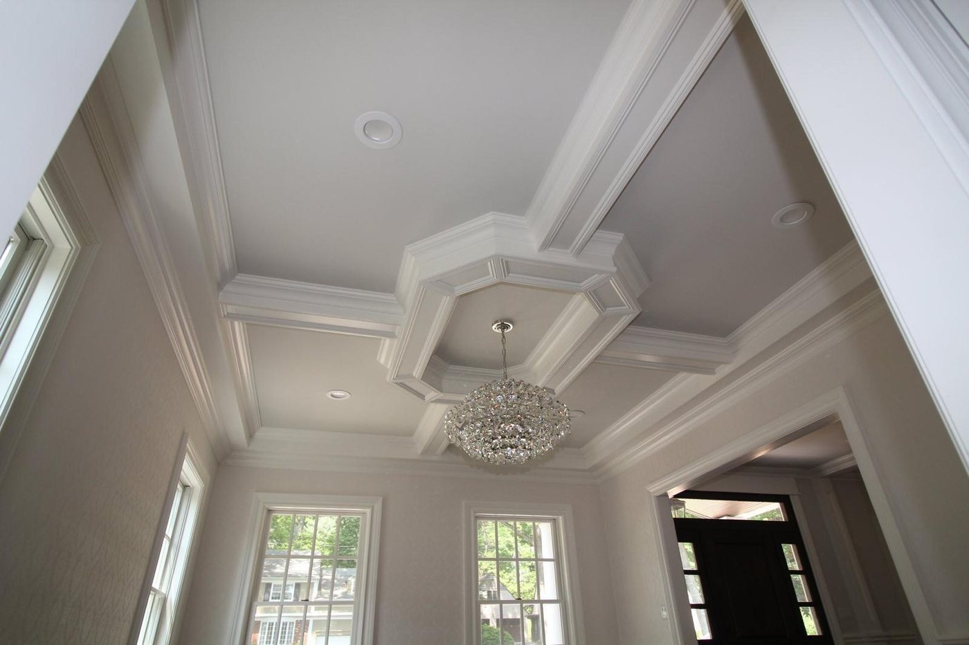 Ornate coffered ceiling medallion with crystal chandelier